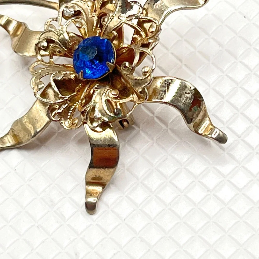 Vintage Gold Tone Flower Brooch w/ Blue and Clear Rhinestones